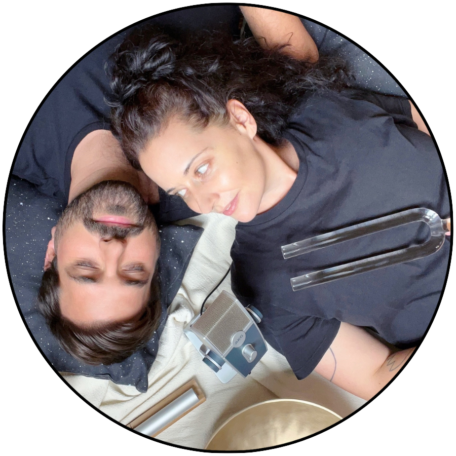 Jenny and Matthias during a sound healing session on Kimolos, Greece, with tuning fork, microphone and crystal singing bowls