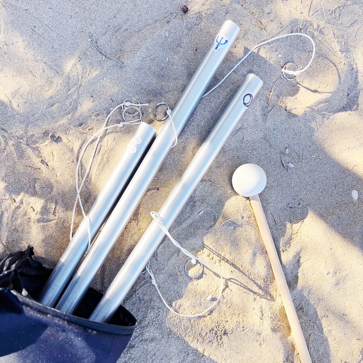 Planetary sound tubes on the sand of Kimolos Island, Greece. Part of the Cosmic Sounds Healing sessions using authentic acoustic instruments tuned to planetary frequencies.