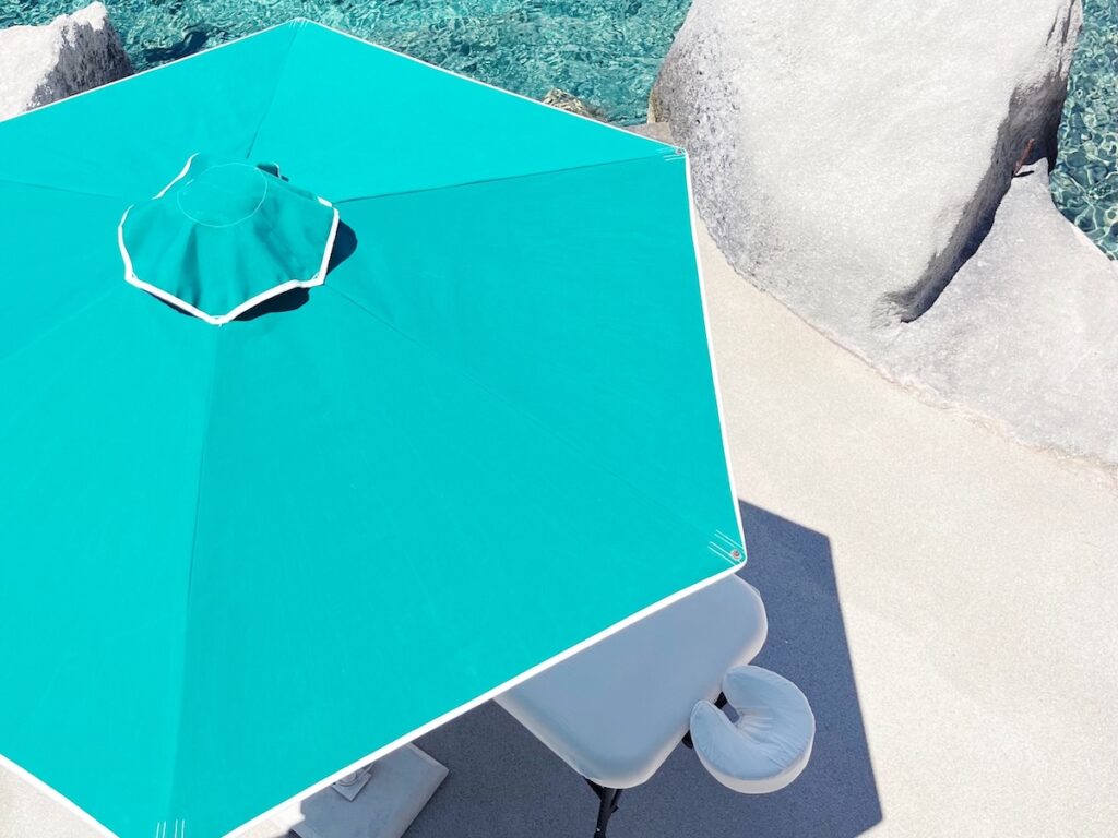 Turquoise sea view and massage setting at Chroma Cove Suites on Kimolos island, Greece